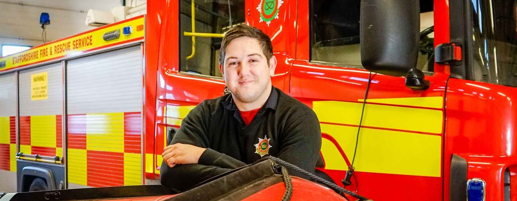 Apprentice stood in front of fire engine