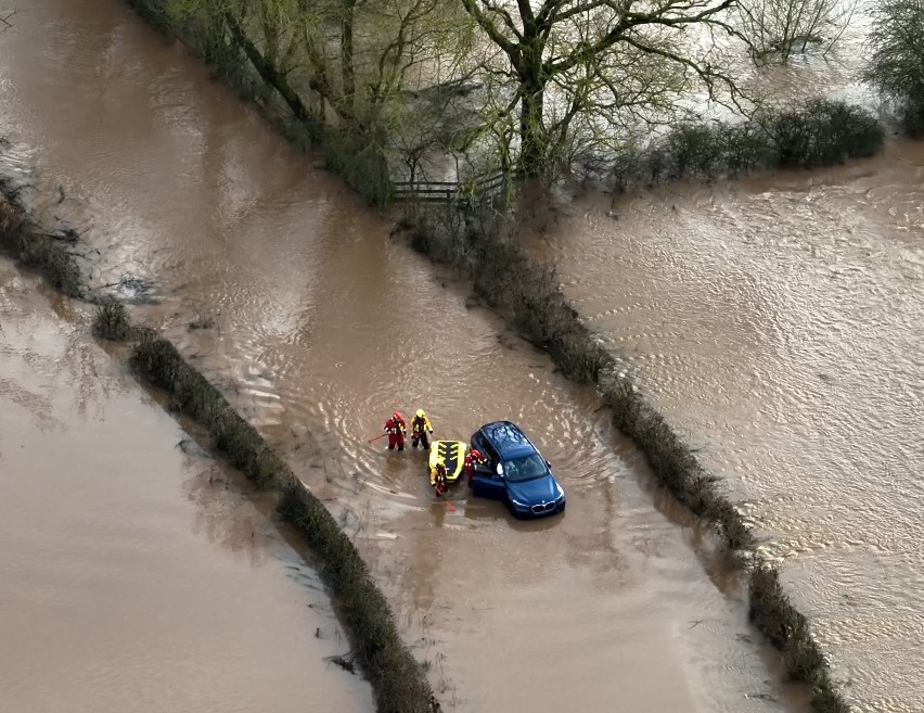 Crews Rescue Woman From Car Stuck In Flood Water