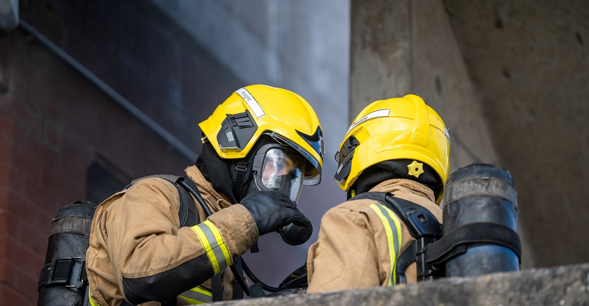 Two firefighters talking