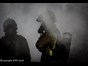 Two firefighter silhouettes in smoke